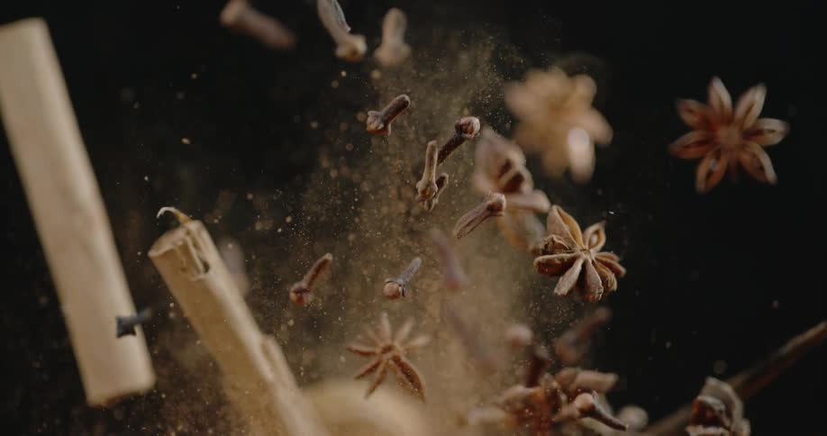 Spices being tossed into the air and falling back down