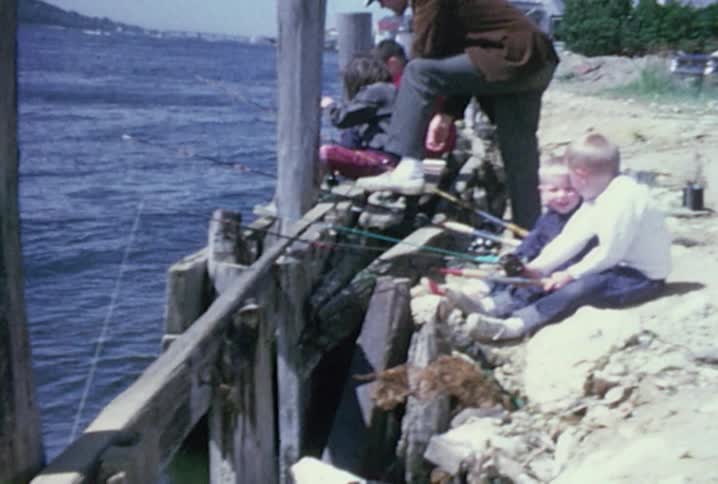 People are sitting on the wooden docks fishing