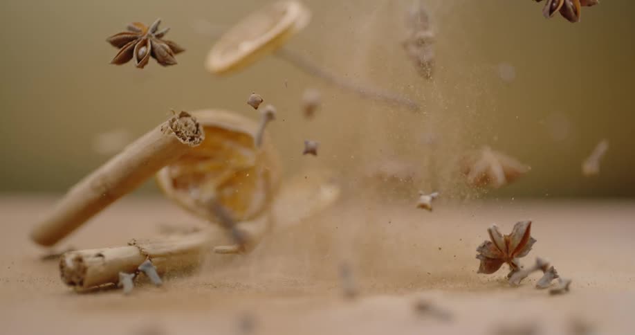 A mix of dried potpourri is launched up into the air after the surface that it is on is bumped from below