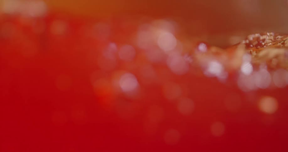 Red liquid moving in slow motion