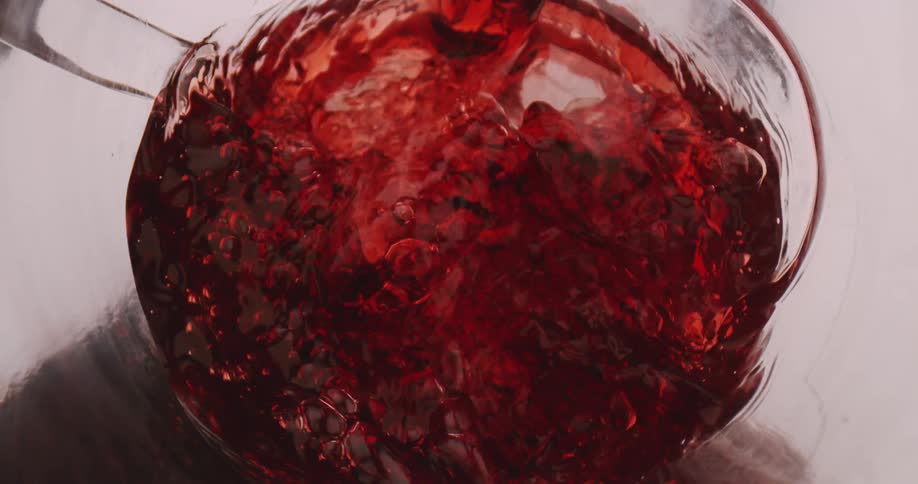 Close up of wine being poured into a decanter