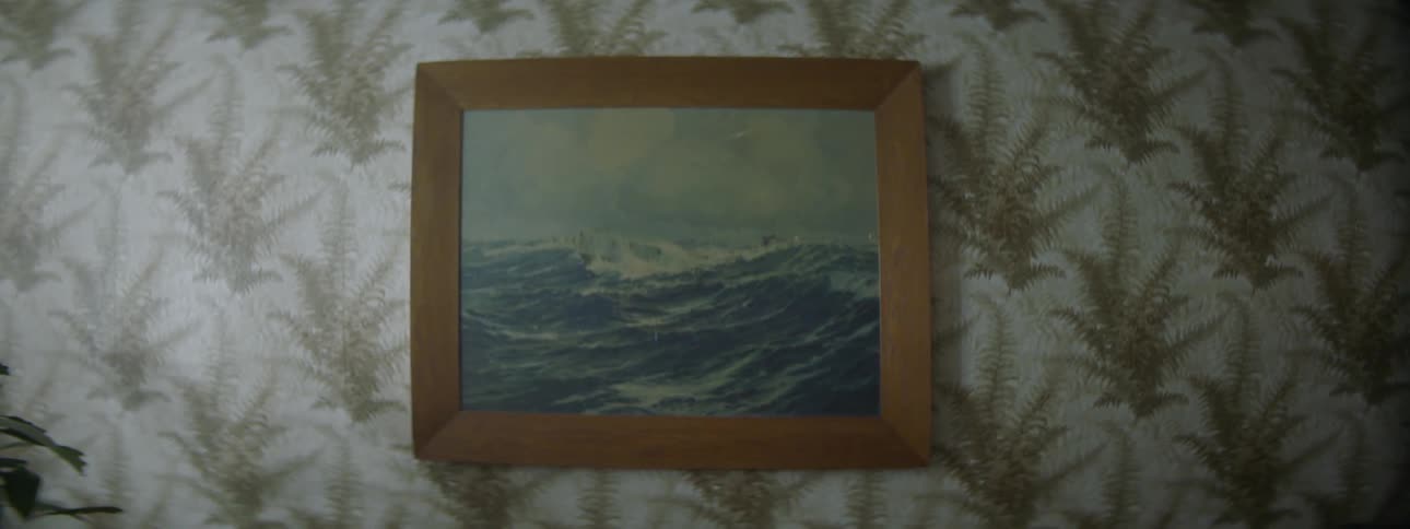 A picture hangs on a wall