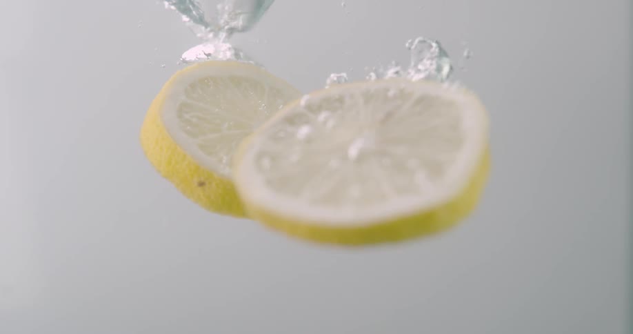 Slices of lemon falling in to water