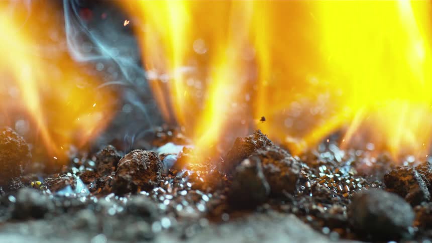 Flames burn and smoke rises