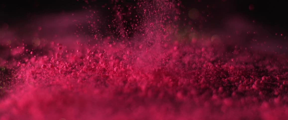 Abstract view of red debris flying in to the air