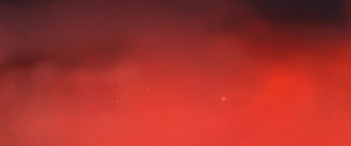 Smoke blowing across a red light