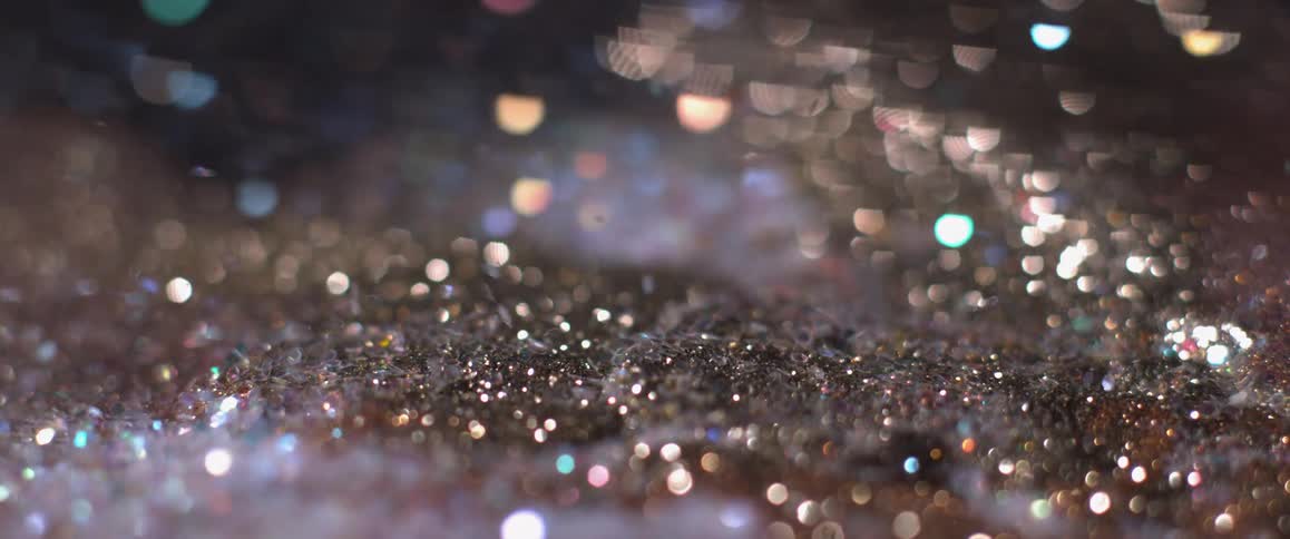 Glitter being blown by wind