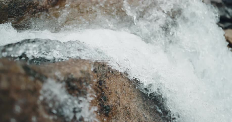 Water crashing down the side of a cliff