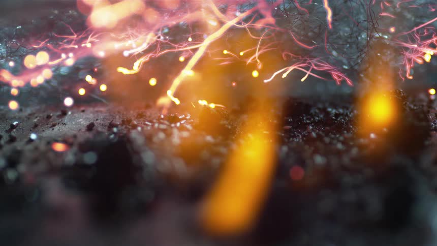 Burning remains of fireworks flaming and sparkling in the floor