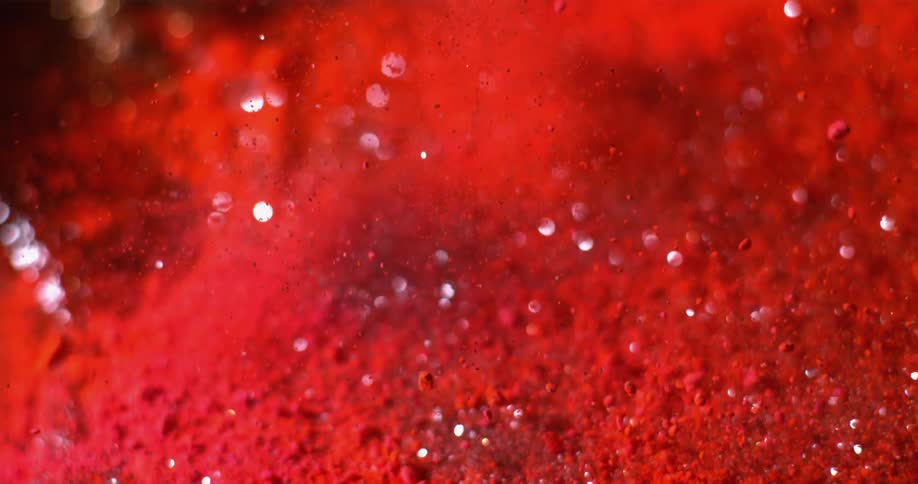 Small red grains glitter and shimmer