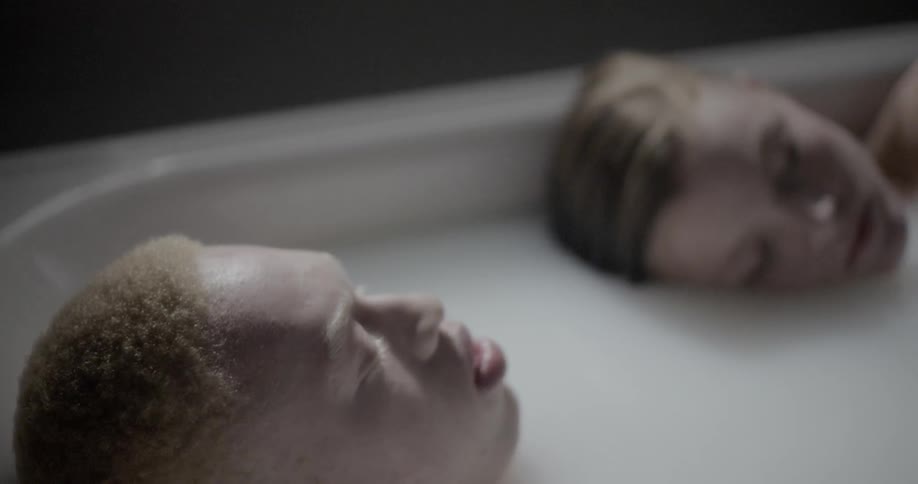 A man and a woman in a bathtub