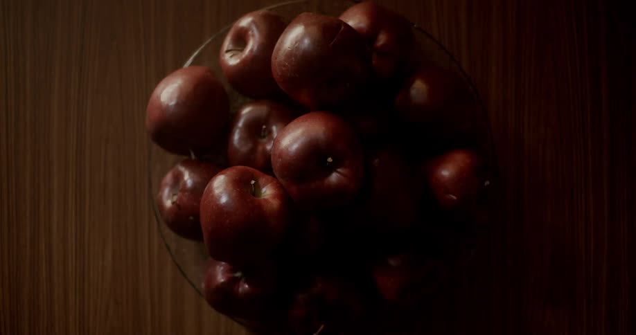 A bowl of apples on a table
