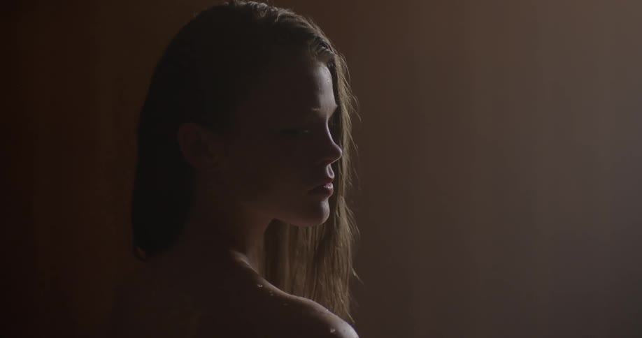 A woman looks to the right