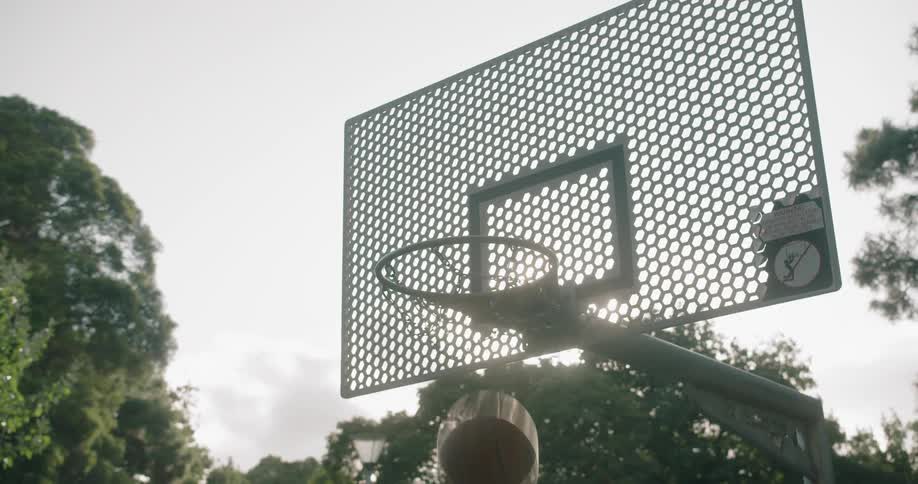 A basketball being shot into a basketball hoop