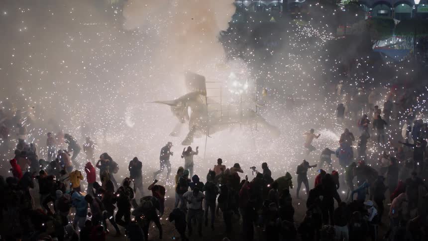 Fireworks exploding in a crowded celebration