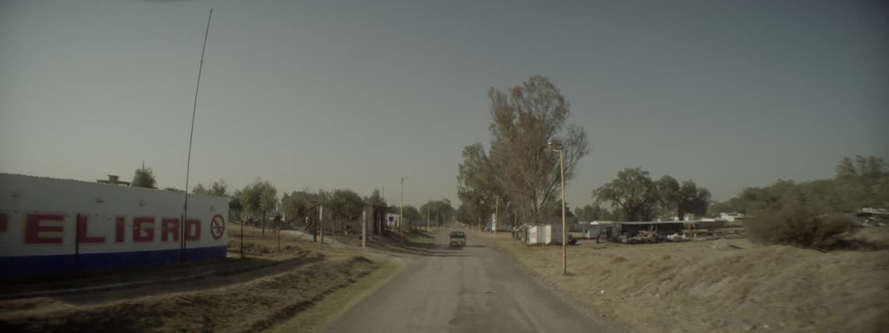 Driving on a road through a small town in a rural area