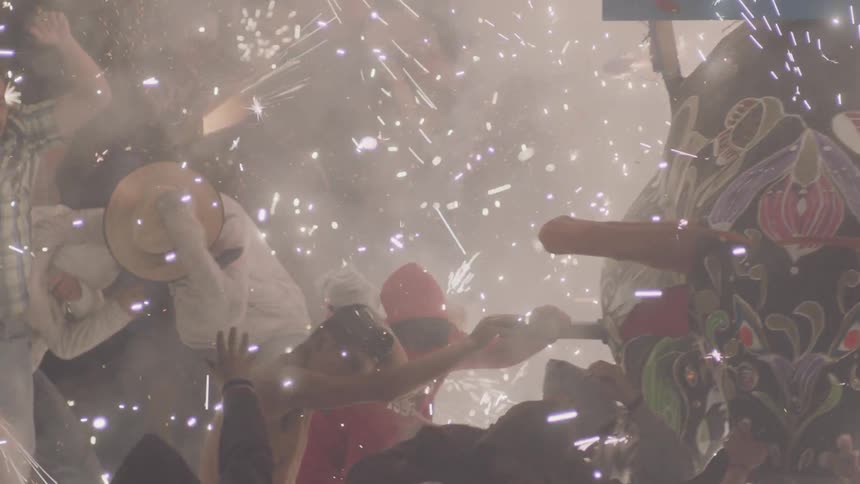 People celebrating with fireworks and floats
