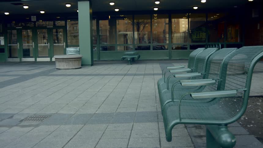 Benches sit outside of a building