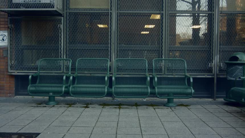 The seats outside the building are empty