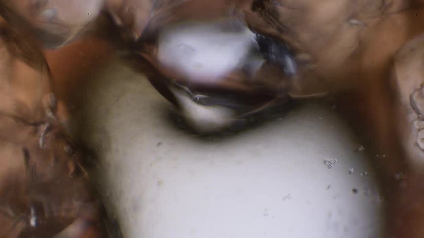 Abstract liquid moves around a crystal