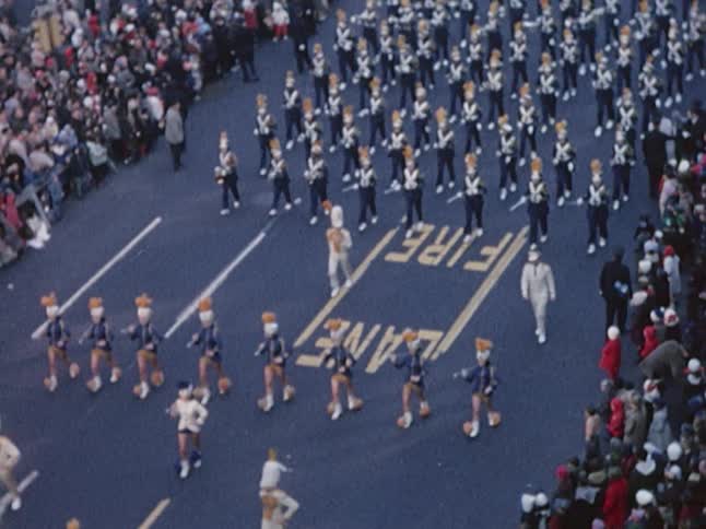 A parade marching down the street