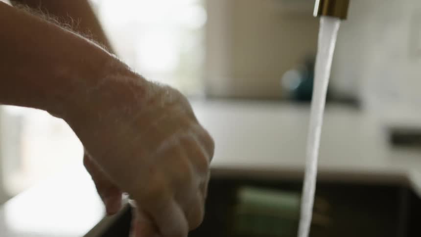 A person is washing their hands