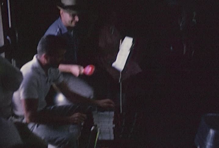 A group of people playing instruments on a train