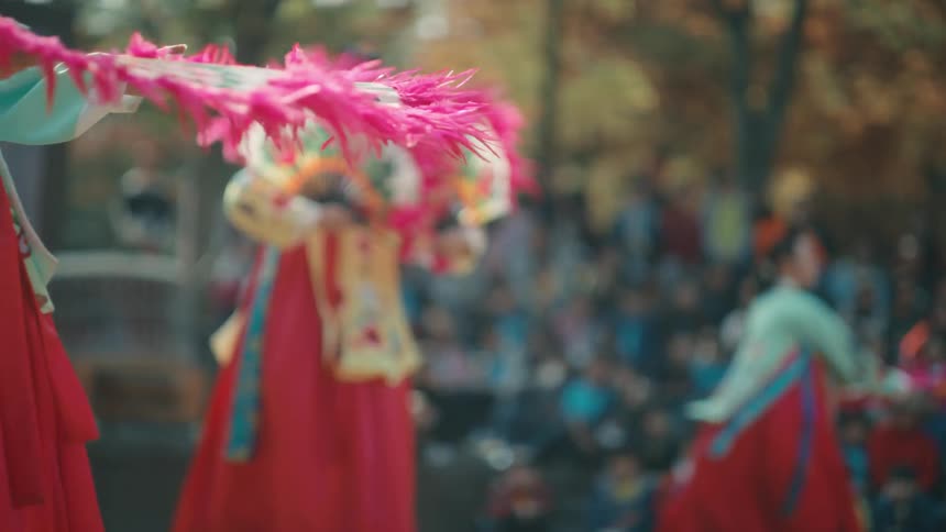 A woman performs in a street fair