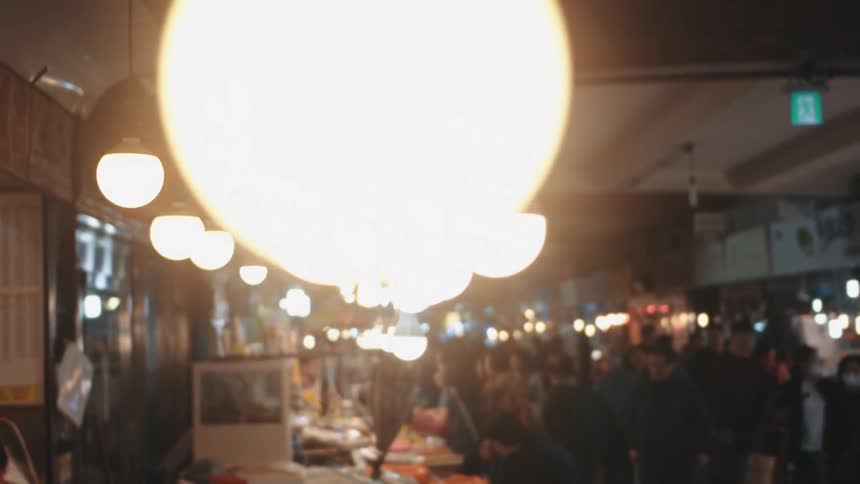 The market has many stands with people browsing