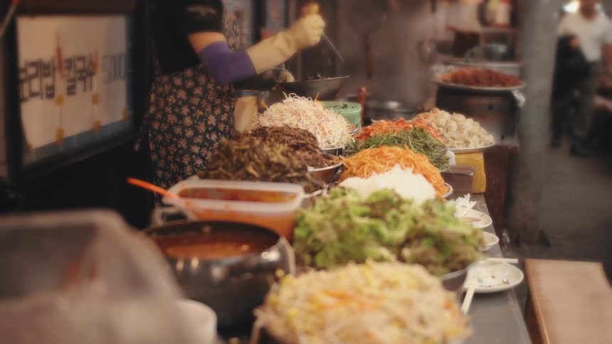 Food sorted into dishes on a counter in a restaurant