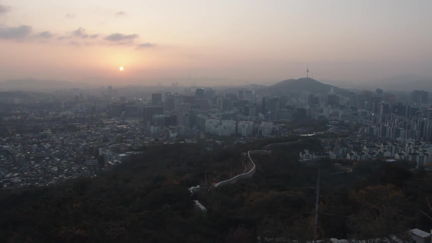A sprawling city and neighborhood surrounding the great wall of china