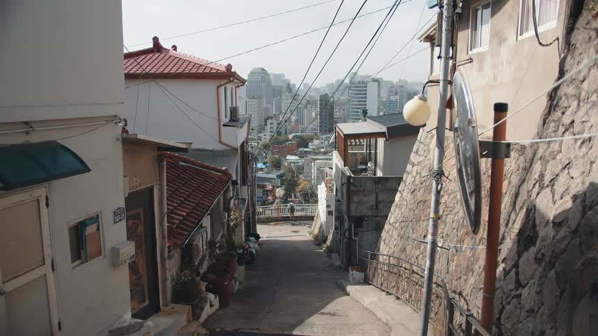 Buildings line an alley in a city