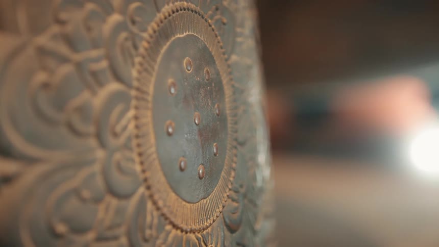 The item has carvings on the side