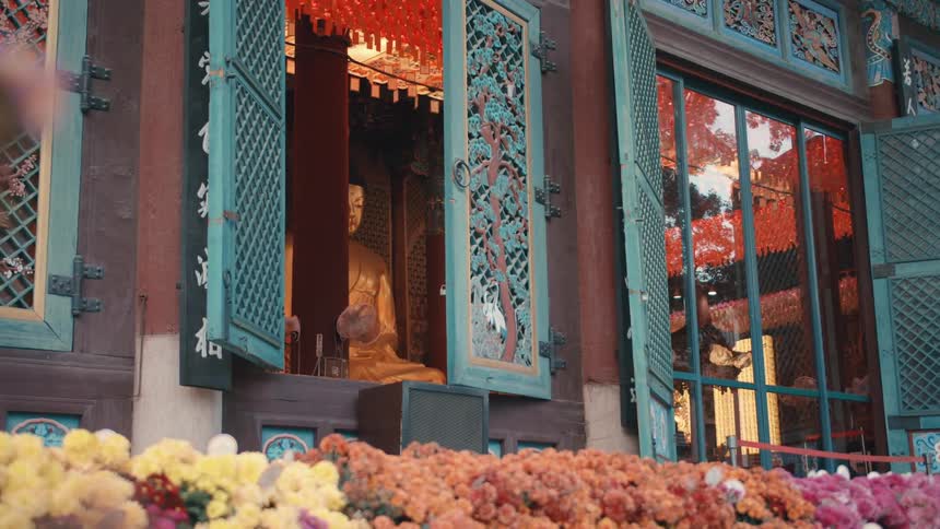 A large statue sits tall in the building