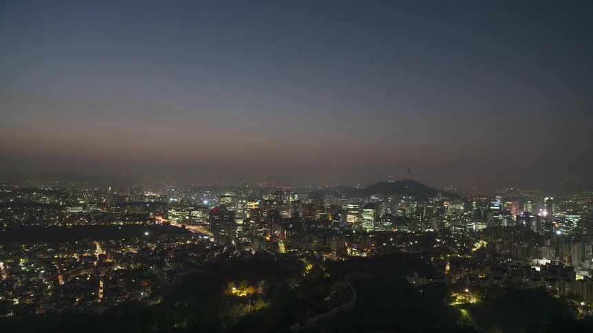 City lights and streets change as night turns into dawn