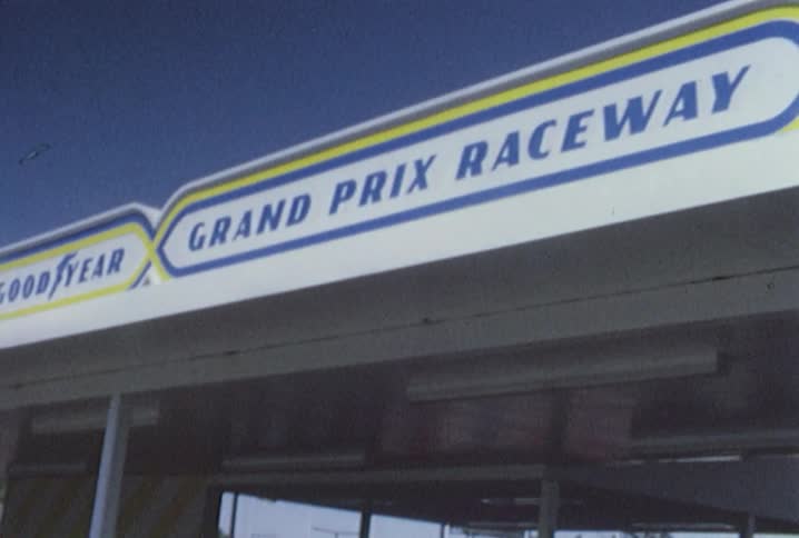 The sign on top of a gas station says good year