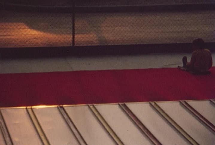 Child arrives at the end of an amusement park slide