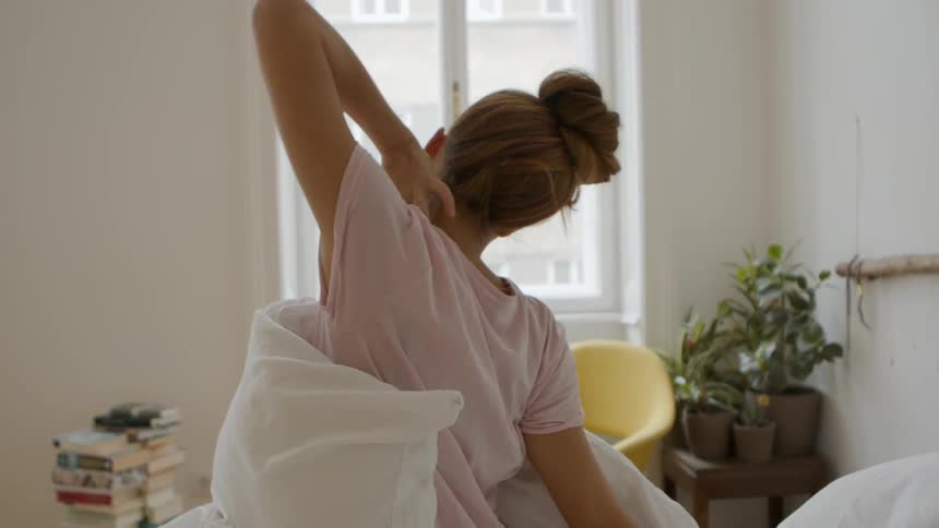 Woman stretching in bed after wake up in morning