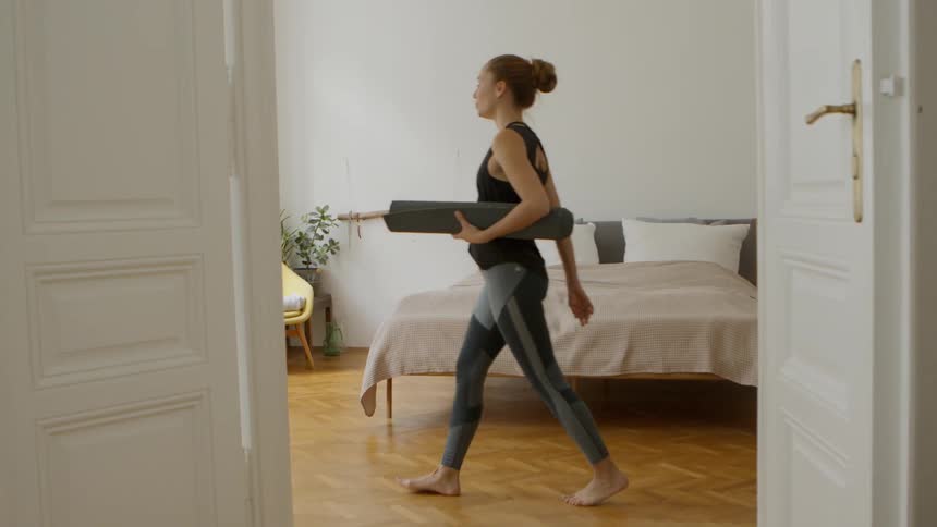 A woman walks across the room