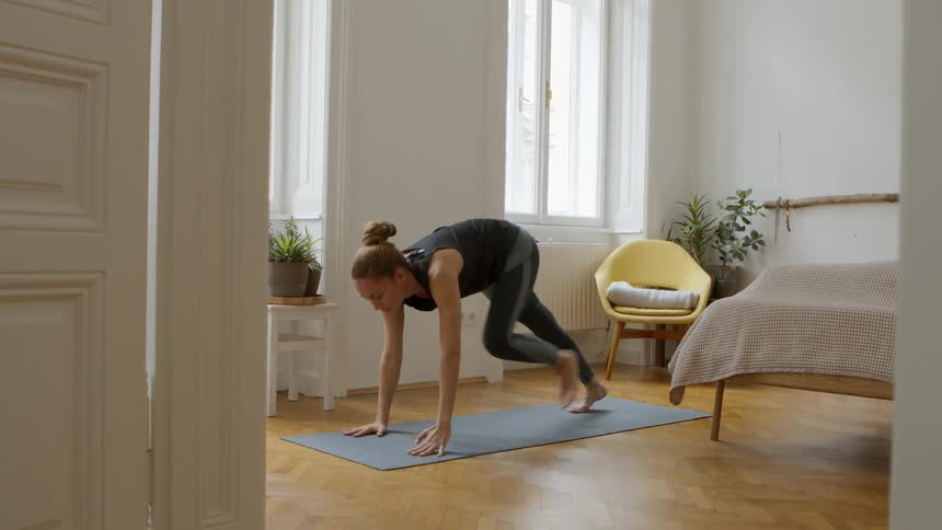 A woman on a mat stretching