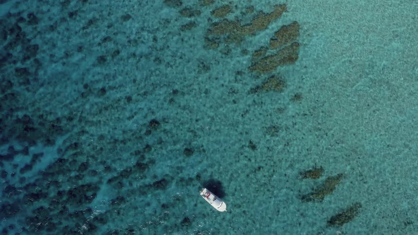 A yacht is alone is a vast ocean