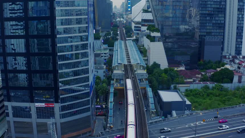 The train travels into the city on the platform