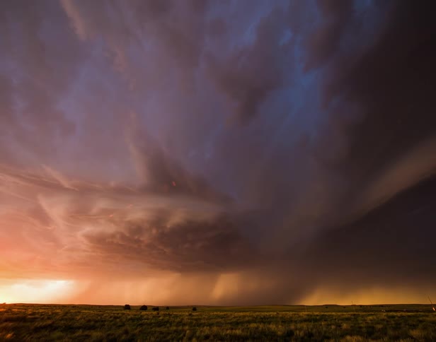 The storm is spinning in the field in the distance