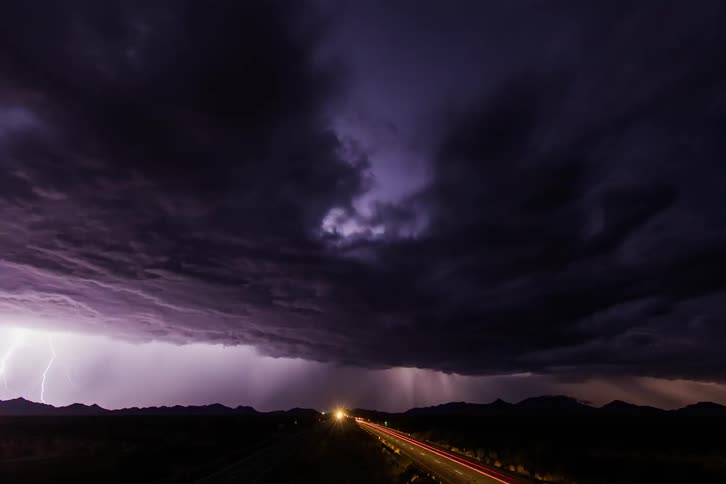 Time lapse of dark clouds and lightning