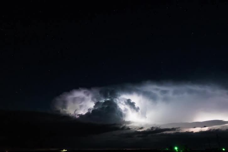 Powerful thunderstorm rolls over the land at night