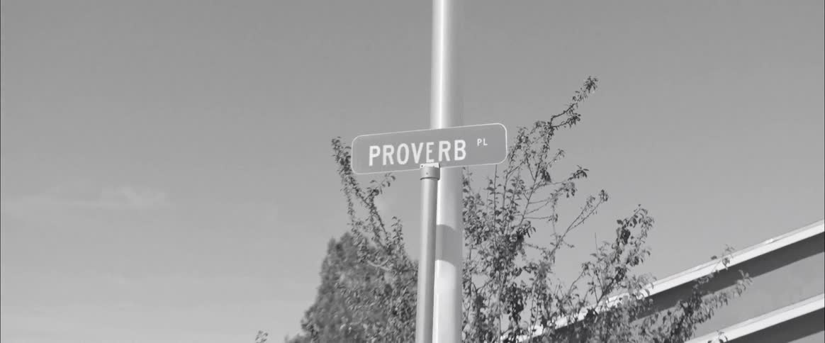 A street sign near a pole