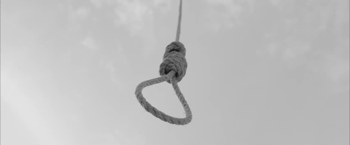 A hanging noose with the sky in the background