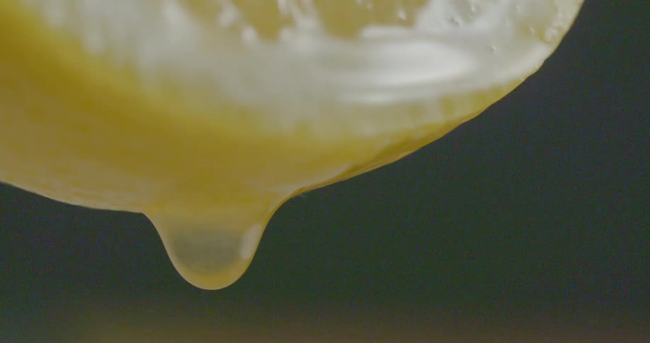 A lemon is dripping juice slowly