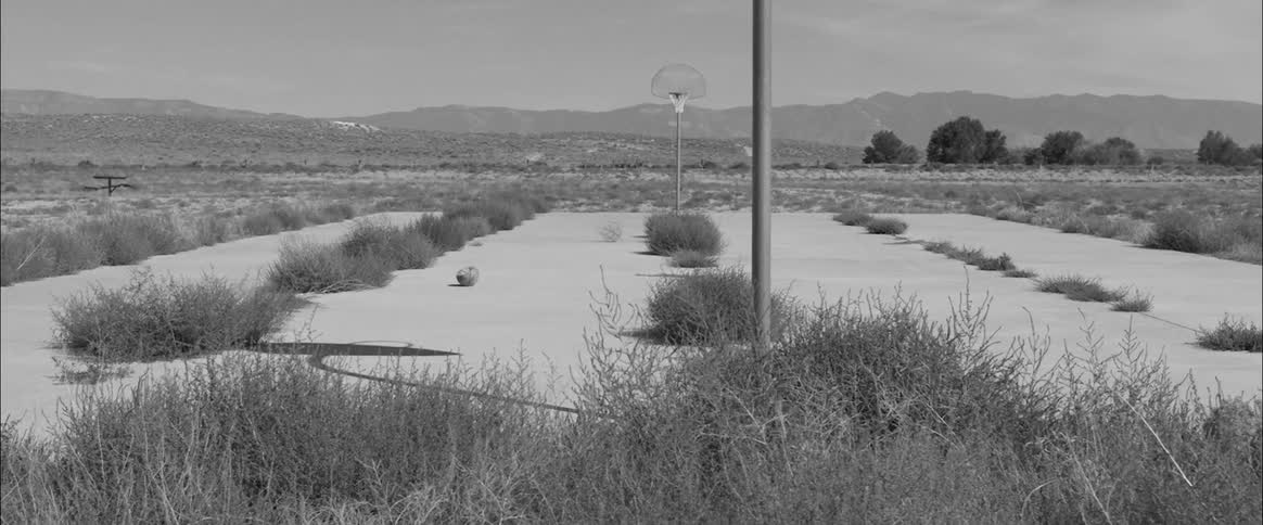A basketball court in the distance
