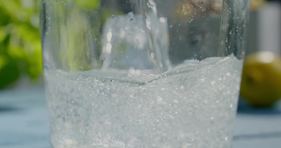 A beverage being poured in to a glass